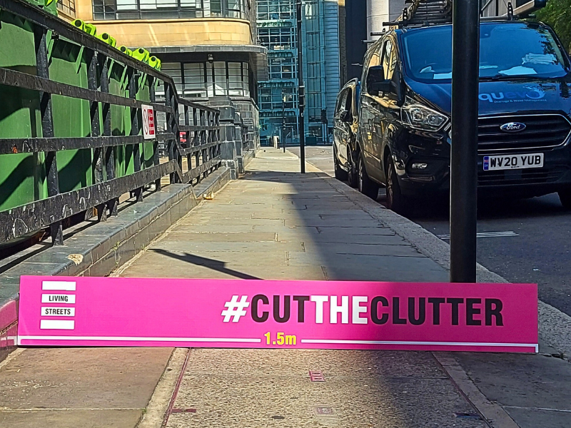 cut the clutter placard on the street